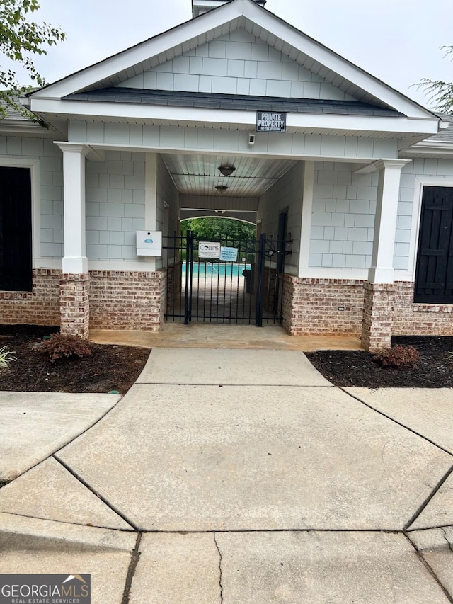1749 Misselthrush Ln, Mcdonough, GA 30253 - view of community featuring a gate and driveway
