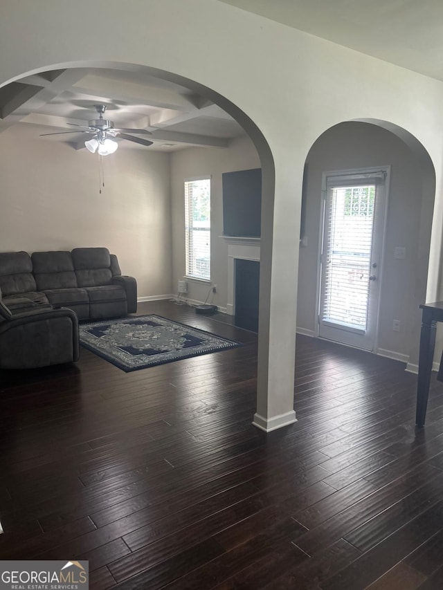 1749 Misselthrush Ln, Mcdonough, GA 30253 - living area with a ceiling fan, dark wood finished floors, a fireplace, healthy amount of natural light, and coffered ceiling