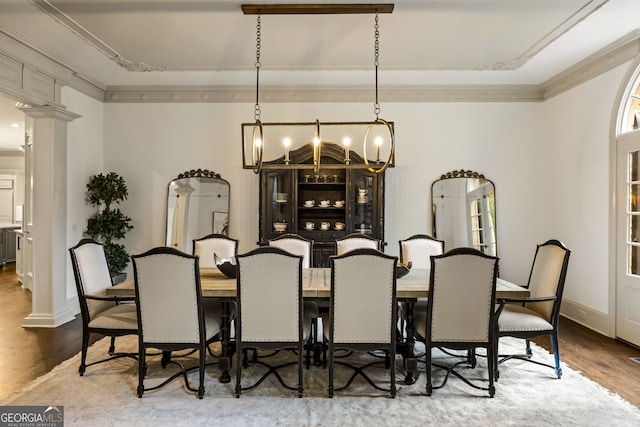 816 Blackfoot Trl, Suwanee, GA 30024 - dining space with crown molding, wood finished floors, a chandelier, decorative columns, and baseboards