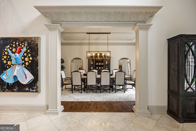 816 Blackfoot Trl, Suwanee, GA 30024 - tiled dining space featuring decorative columns, a chandelier, and baseboards