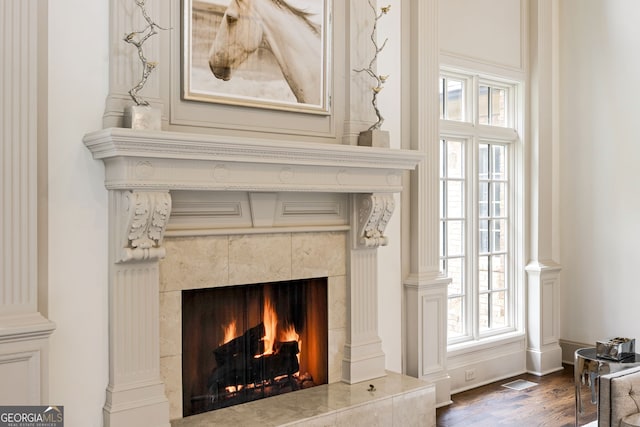 816 Blackfoot Trl, Suwanee, GA 30024 - detailed view of a tiled fireplace and wood finished floors