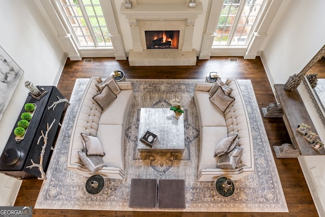 816 Blackfoot Trl, Suwanee, GA 30024 - living area with plenty of natural light, a fireplace, and wood finished floors
