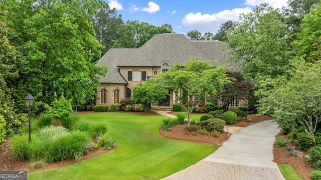 816 Blackfoot Trl, Suwanee, GA 30024 - french provincial home with a front yard and driveway