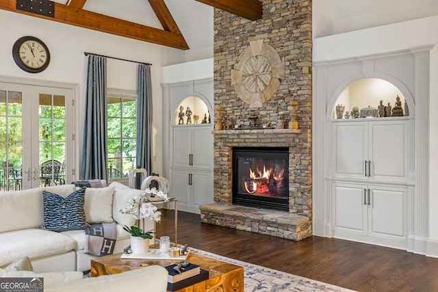 816 Blackfoot Trl, Suwanee, GA 30024 - living room featuring french doors, dark wood-type flooring, beamed ceiling, a fireplace, and high vaulted ceiling