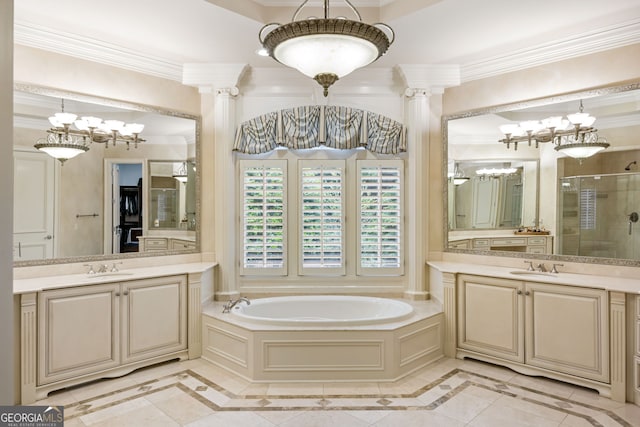 816 Blackfoot Trl, Suwanee, GA 30024 - bathroom featuring inlaid floor details, ornamental molding, a shower stall, a chandelier, and a garden tub
