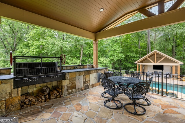 816 Blackfoot Trl, Suwanee, GA 30024 - view of patio / terrace featuring area for grilling, a sink, and view of wooded area