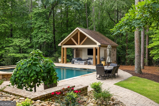 816 Blackfoot Trl, Suwanee, GA 30024 - swimming pool featuring an outdoor living space, a patio area, a storage structure, an in-ground hot tub, and an outdoor structure