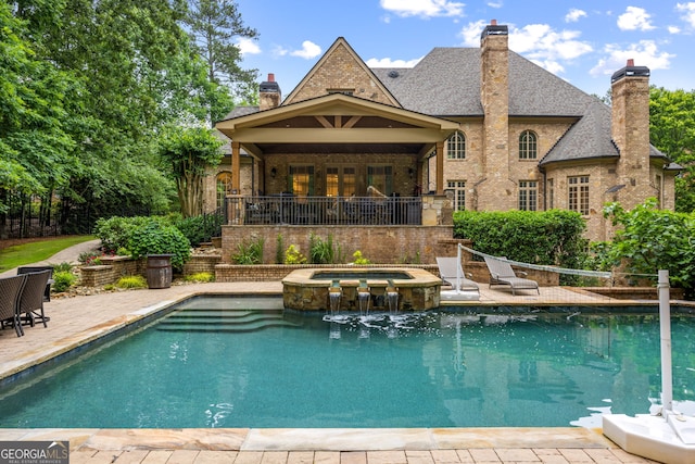 816 Blackfoot Trl, Suwanee, GA 30024 - view of swimming pool with a pool with connected hot tub and a patio