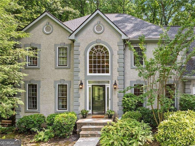 4402 Windsor Oaks Chase, Marietta, GA 30066 - view of front facade featuring a shingled roof and stucco siding