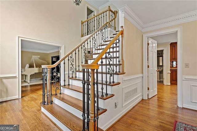 4402 Windsor Oaks Chase, Marietta, GA 30066 - stairs featuring wood finished floors and crown molding
