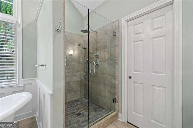 4402 Windsor Oaks Chase, Marietta, GA 30066 - full bath featuring a shower stall, plenty of natural light, a freestanding bath, wainscoting, and a decorative wall