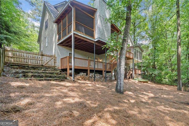 4402 Windsor Oaks Chase, Marietta, GA 30066 - rear view of property with a sunroom and a deck