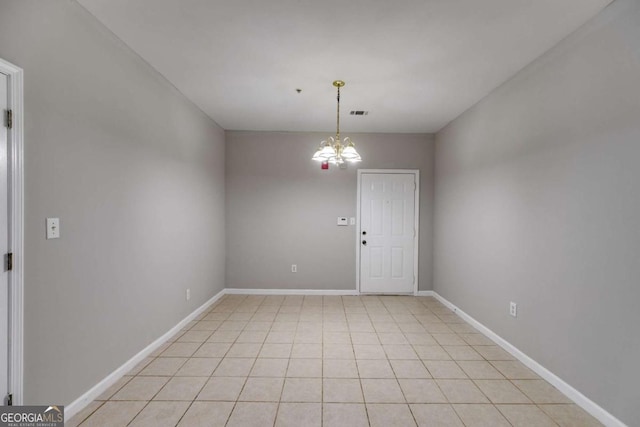 7712 Autry Cir Unit 701, Douglasville, GA 30134 - empty room featuring a chandelier and light tile patterned floors