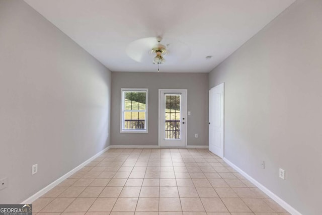 7712 Autry Cir Unit 701, Douglasville, GA 30134 - spare room featuring ceiling fan, baseboards, and light tile patterned floors