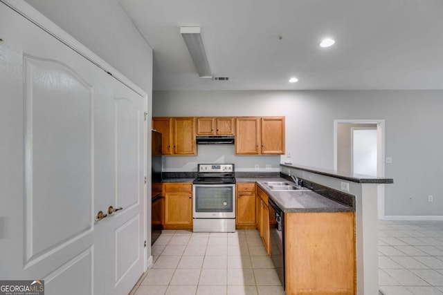 7712 Autry Cir Unit 701, Douglasville, GA 30134 - kitchen featuring stainless steel appliances, a sink, light tile patterned flooring, dark countertops, and under cabinet range hood