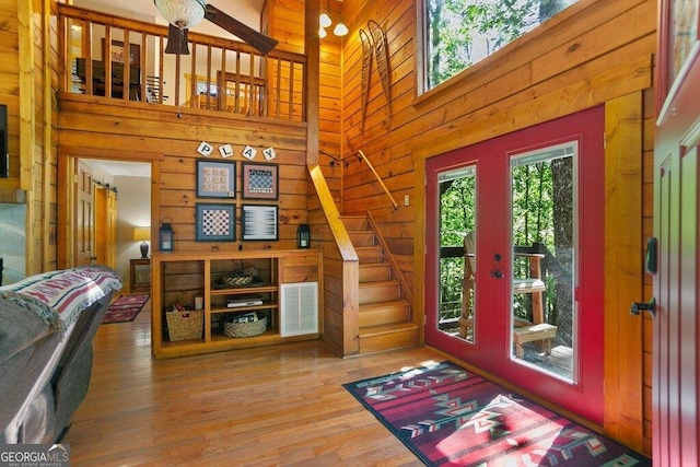 488 S Lemmon Ln Unit 289, Ellijay, GA 30540 - foyer featuring wood finished floors, a high ceiling, wood walls, stairs, and french doors