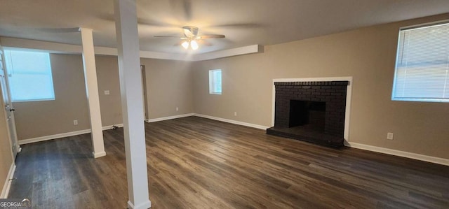 2663 Washington St NW, Atlanta, GA 30318 - unfurnished living room featuring dark wood finished floors, a ceiling fan, and a fireplace