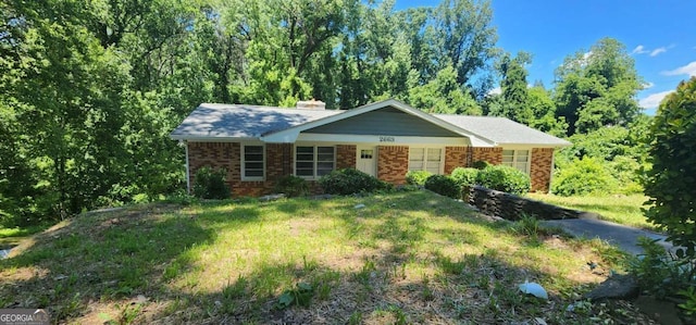 2663 Washington St NW, Atlanta, GA 30318 - single story home featuring brick siding, a chimney, and a front yard
