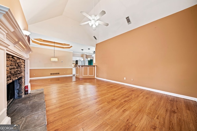 120 Bent Creek Dr, Woodstock, GA 30189 - unfurnished living room with ceiling fan, a fireplace, light wood-type flooring, and lofted ceiling
