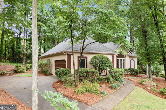 120 Bent Creek Dr, Woodstock, GA 30189 - view of front of property with stucco siding, a garage, asphalt driveway, and a shingled roof