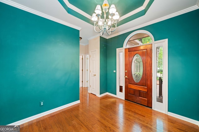 120 Bent Creek Dr, Woodstock, GA 30189 - entrance foyer with a chandelier, wood finished floors, baseboards, crown molding, and a raised ceiling