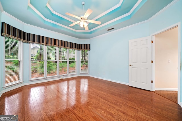 120 Bent Creek Dr, Woodstock, GA 30189 - unfurnished room with a raised ceiling, crown molding, ceiling fan, wood finished floors, and baseboards