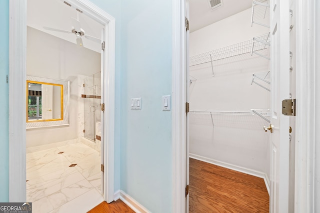 120 Bent Creek Dr, Woodstock, GA 30189 - full bath featuring a stall shower, a walk in closet, and baseboards