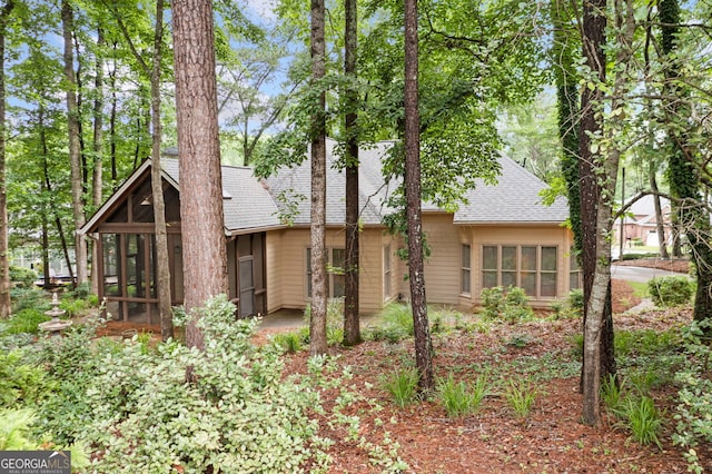 120 Bent Creek Dr, Woodstock, GA 30189 - mid-century inspired home with a shingled roof and a sunroom