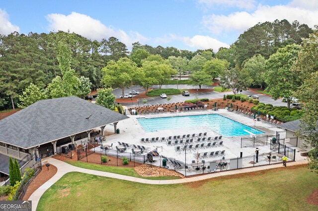 120 Bent Creek Dr, Woodstock, GA 30189 - community pool featuring a patio area and view of scattered trees