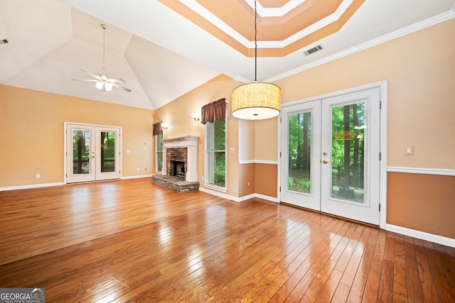 120 Bent Creek Dr, Woodstock, GA 30189 - unfurnished living room featuring french doors, hardwood / wood-style flooring, a ceiling fan, baseboards, and crown molding
