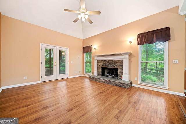 120 Bent Creek Dr, Woodstock, GA 30189 - unfurnished living room featuring a ceiling fan, light wood finished floors, a fireplace, and baseboards