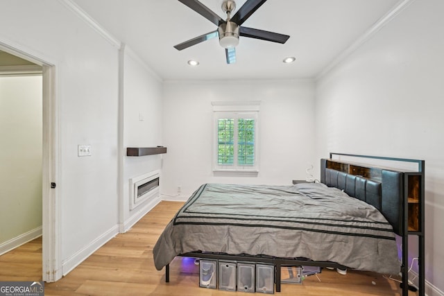 999 Smith St SW, Atlanta, GA 30310 - bedroom with ornamental molding, light wood-style floors, a fireplace, recessed lighting, and ceiling fan