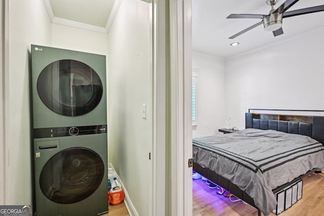 999 Smith St SW, Atlanta, GA 30310 - laundry room featuring stacked washer / dryer, wood finished floors, ornamental molding, and a ceiling fan