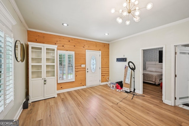 999 Smith St SW, Atlanta, GA 30310 - foyer featuring ornamental molding, wooden walls, light wood-style flooring, recessed lighting, and a chandelier