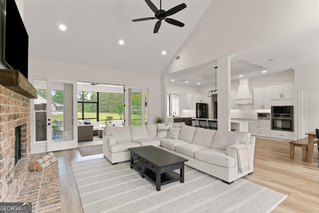 31 Bitter End Ct, Waverly, GA 31565 - living area featuring high vaulted ceiling, a ceiling fan, a fireplace, recessed lighting, and light wood-style flooring
