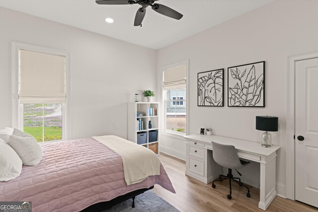 31 Bitter End Ct, Waverly, GA 31565 - bedroom with light wood-type flooring, an office area, and a ceiling fan