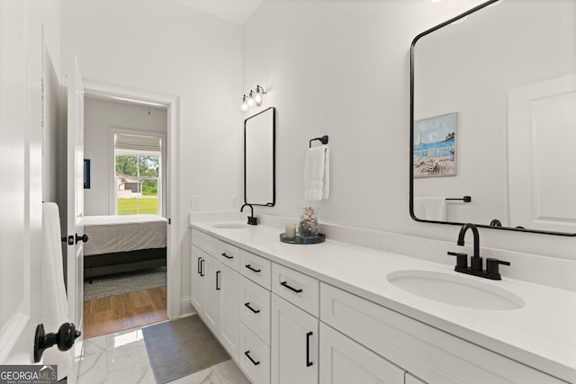 31 Bitter End Ct, Waverly, GA 31565 - bathroom with double vanity, connected bathroom, and marble finish flooring