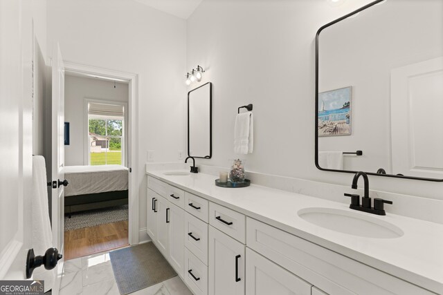 31 Bitter End Ct, Waverly, GA 31565 - ensuite bathroom featuring double vanity and marble finish floors
