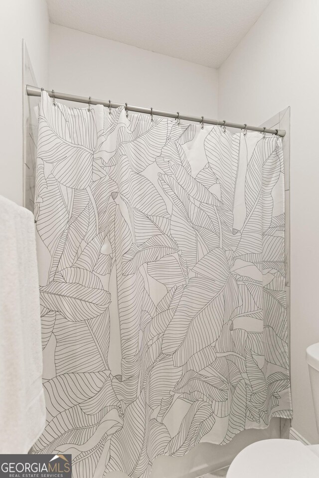 31 Bitter End Ct, Waverly, GA 31565 - bathroom with a shower with curtain