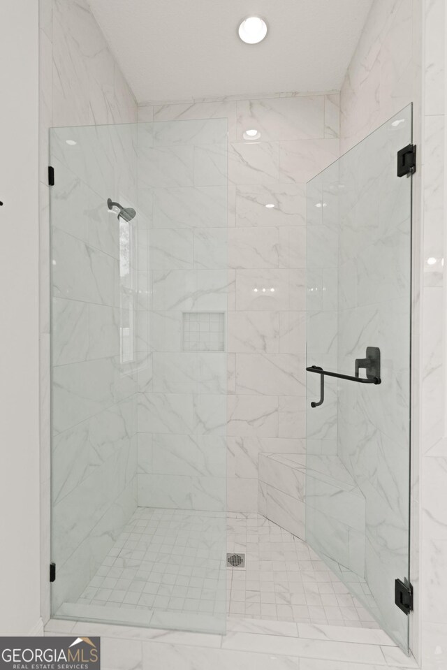 31 Bitter End Ct, Waverly, GA 31565 - bathroom featuring a marble finish shower