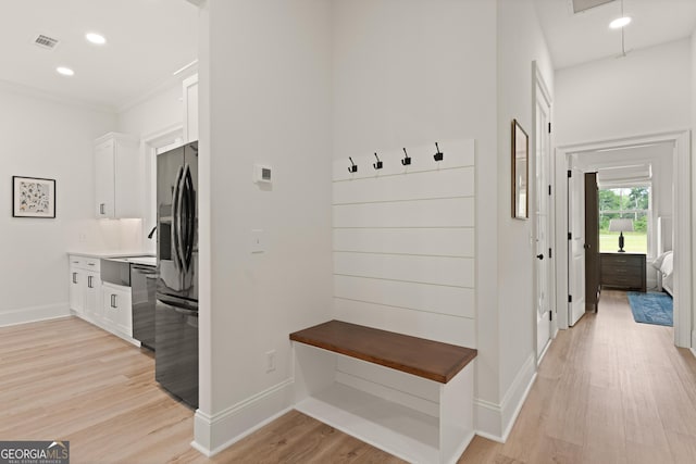 31 Bitter End Ct, Waverly, GA 31565 - mudroom featuring baseboards, light wood-style floors, recessed lighting, a sink, and crown molding