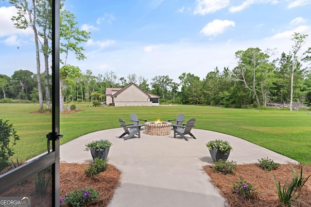31 Bitter End Ct, Waverly, GA 31565 - view of patio featuring an outdoor fire pit and view of scattered trees