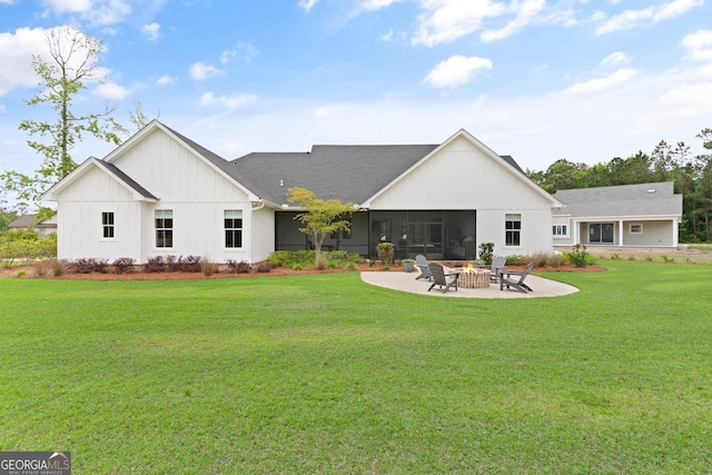31 Bitter End Ct, Waverly, GA 31565 - back of property with an outdoor fire pit, a patio, a yard, board and batten siding, and roof with shingles