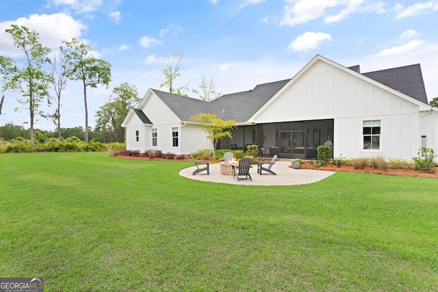 31 Bitter End Ct, Waverly, GA 31565 - back of house with a patio area, a yard, a shingled roof, board and batten siding, and a sunroom
