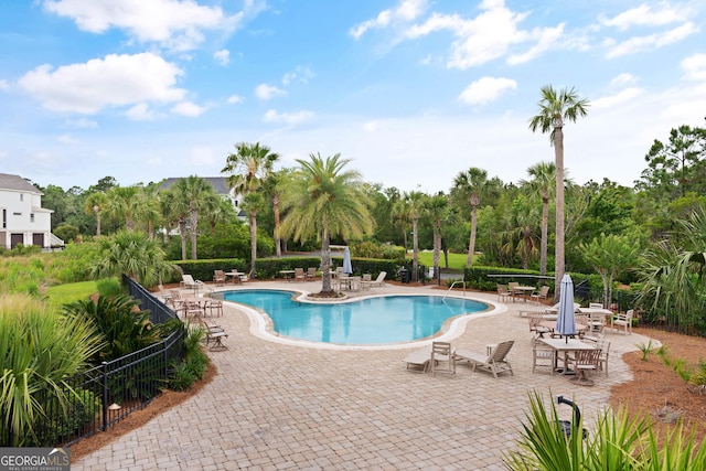 31 Bitter End Ct, Waverly, GA 31565 - community pool with a patio area and view of wooded area