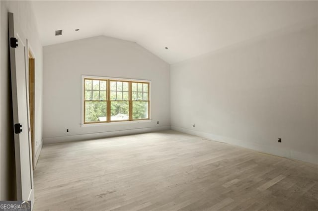 1115 Ralph Rd NE, Atlanta, GA 30324 - spare room with light wood-style floors and vaulted ceiling