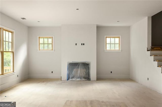 1115 Ralph Rd NE, Atlanta, GA 30324 - unfurnished living room featuring a fireplace and stairway