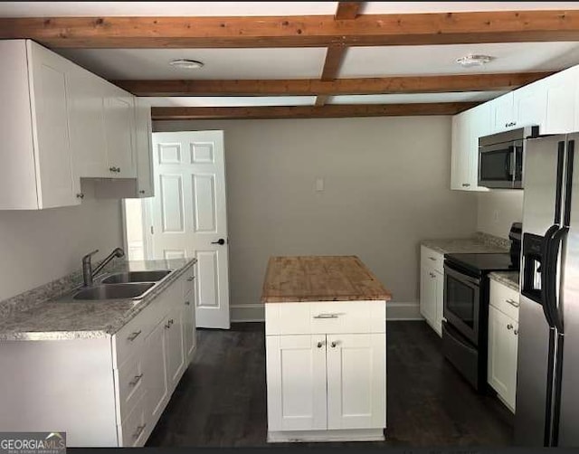 3774 Seasons Dr NW, Acworth, GA 30101 - kitchen with appliances with stainless steel finishes, a sink, beamed ceiling, dark wood-style floors, and white cabinetry