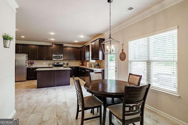 1148 Abe Lincoln Way, Jefferson, GA 30549 - dining space with ornamental molding, healthy amount of natural light, baseboards, a chandelier, and recessed lighting