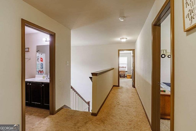 1148 Abe Lincoln Way, Jefferson, GA 30549 - corridor featuring an upstairs landing, light colored carpet, and a sink
